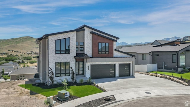 7233 W Summit Top Ln, Herriman, UT 84096 - contemporary house featuring a mountain view, driveway, a standing seam roof, and a garage