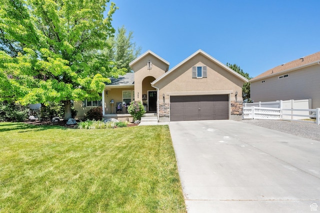 369 E Shelley Ln, Grantsville, UT 84029 - traditional-style house featuring stucco siding, driveway, a garage, stone siding, and covered porch