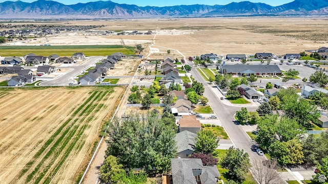 369 E Shelley Ln, Grantsville, UT 84029 - aerial view of sparsely populated area featuring a mountain backdrop and nearby suburban area