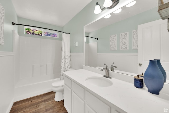 369 E Shelley Ln, Grantsville, UT 84029 - full bathroom with wainscoting, wood finished floors, vanity, and shower / tub combo