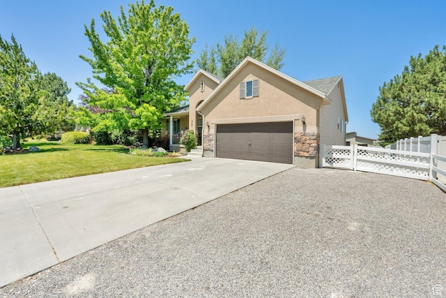 369 E Shelley Ln, Grantsville, UT 84029 - view of front of house featuring concrete driveway, stone siding, an attached garage, and stucco siding