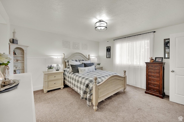 369 E Shelley Ln, Grantsville, UT 84029 - bedroom featuring light colored carpet and a textured ceiling