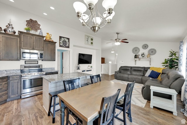 369 E Shelley Ln, Grantsville, UT 84029 - dining area featuring ceiling fan, light wood-type flooring, a chandelier, recessed lighting, and vaulted ceiling