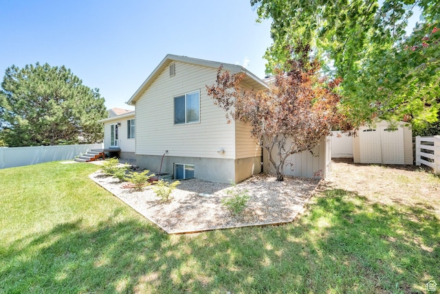 369 E Shelley Ln, Grantsville, UT 84029 - back of house featuring a shed and a fenced backyard