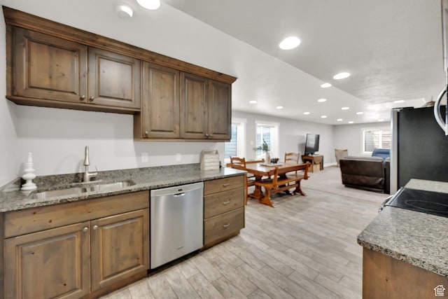 369 E Shelley Ln, Grantsville, UT 84029 - kitchen featuring stainless steel appliances, light wood-type flooring, healthy amount of natural light, recessed lighting, and stone counters