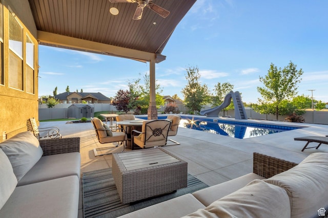 4948 W 4025 S, West Haven, UT 84401 - fenced backyard featuring an outdoor living space, outdoor dining area, a patio, and a ceiling fan