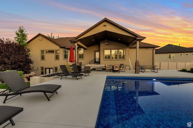 4948 W 4025 S, West Haven, UT 84401 - back of property with outdoor lounge area, ceiling fan, stucco siding, and a patio