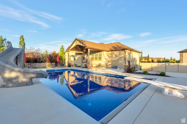 4948 W 4025 S, West Haven, UT 84401 - view of pool with a water slide, a patio area, and a diving board
