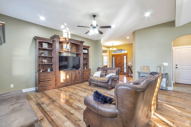 4948 W 4025 S, West Haven, UT 84401 - living area with light wood-type flooring, ceiling fan, a chandelier, arched walkways, and recessed lighting