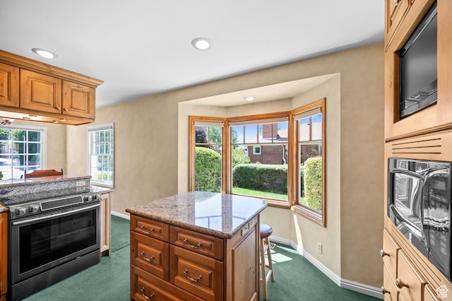1632 S 1500 E, Salt Lake City, UT 84105 - kitchen with stainless steel electric range, dark carpet, light stone countertops, brown cabinetry, and recessed lighting