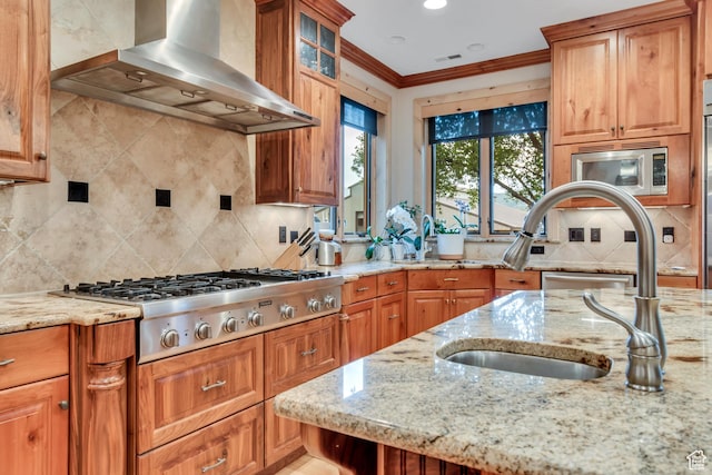 2984 Winterton Rd, Charleston, UT 84032 - kitchen with wall chimney exhaust hood, appliances with stainless steel finishes, tasteful backsplash, crown molding, and light stone counters