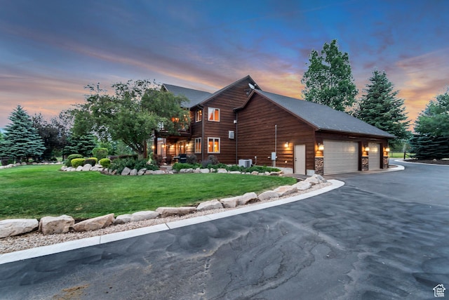 2984 Winterton Rd, Charleston, UT 84032 - view of side of property featuring a garage, a lawn, asphalt driveway, and a balcony