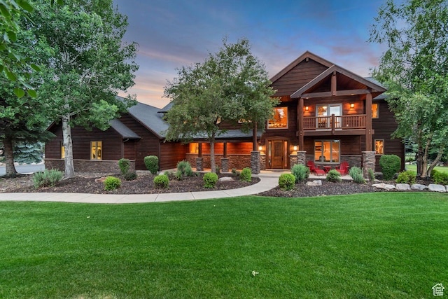 2984 Winterton Rd, Charleston, UT 84032 - back of house featuring a porch, stone siding, and a yard