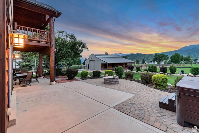 2984 Winterton Rd, Charleston, UT 84032 - patio terrace at dusk with a mountain view, a patio, a balcony, and an outdoor fire pit