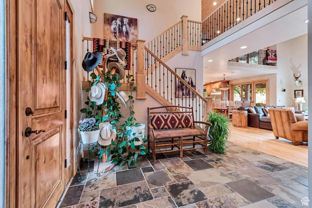 2984 Winterton Rd, Charleston, UT 84032 - stairs featuring a high ceiling, stone tile floors, and recessed lighting