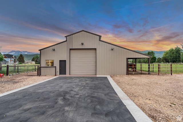 2984 Winterton Rd, Charleston, UT 84032 - outdoor structure at dusk featuring a mountain view, driveway, and an exterior structure