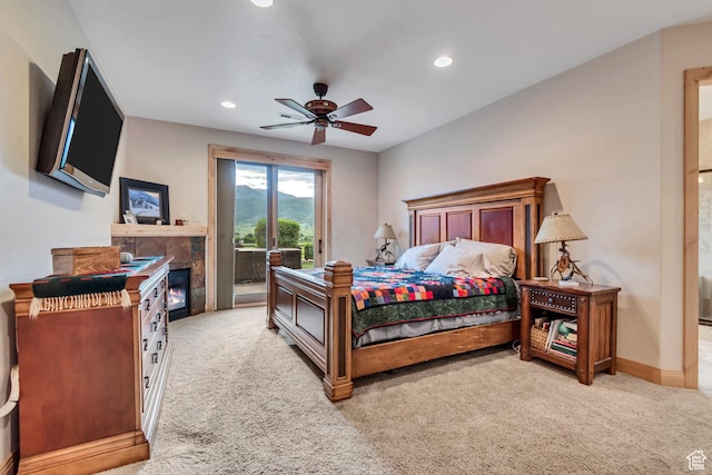 2984 Winterton Rd, Charleston, UT 84032 - bedroom with access to outside, light colored carpet, recessed lighting, a tiled fireplace, and a ceiling fan