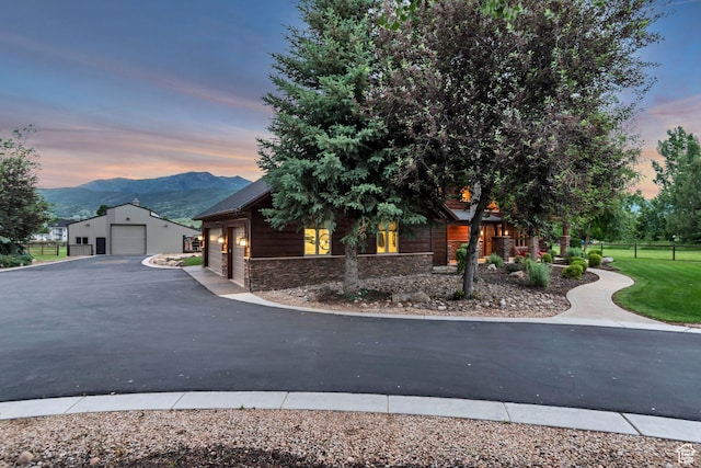 2984 Winterton Rd, Charleston, UT 84032 - view of front of home featuring stone siding, a mountain view, an outbuilding, and a detached garage