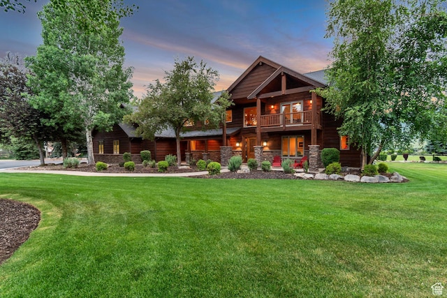 2984 Winterton Rd, Charleston, UT 84032 - view of front of property with a front yard, a balcony, and stone siding