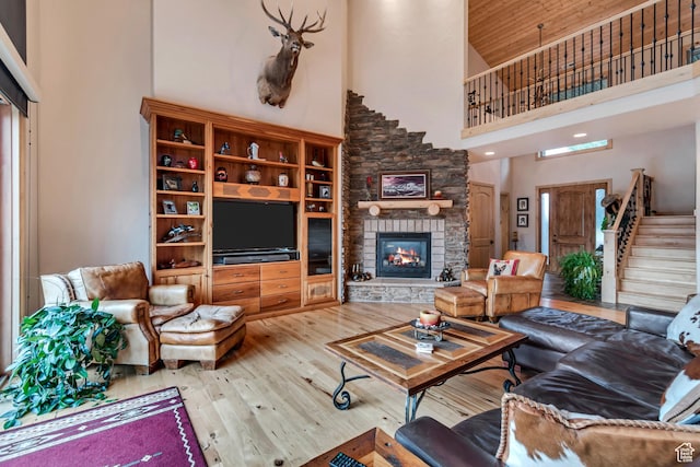 2984 Winterton Rd, Charleston, UT 84032 - living area with high vaulted ceiling, wood-type flooring, a fireplace, stairway, and wooden ceiling
