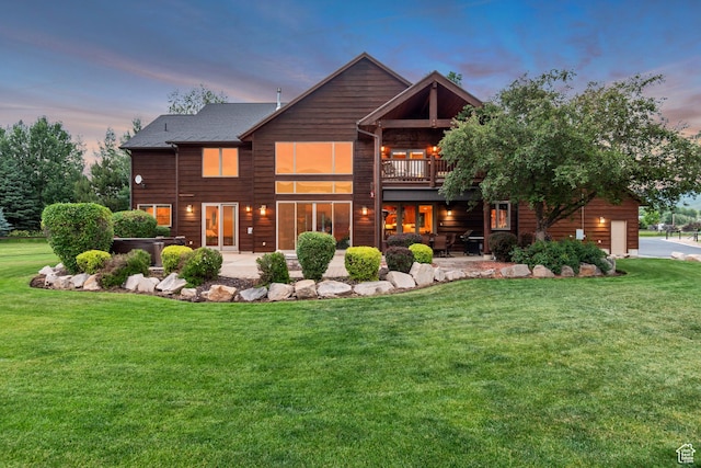 2984 Winterton Rd, Charleston, UT 84032 - back of property at dusk with a yard and a patio area