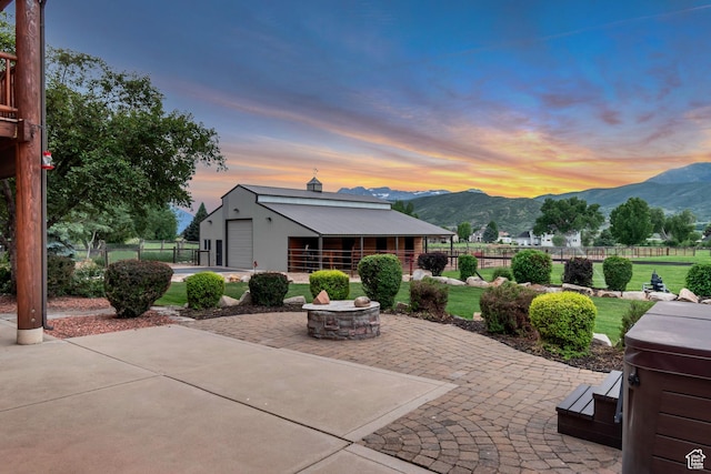 2984 Winterton Rd, Charleston, UT 84032 - view of patio featuring a mountain view, an outbuilding, and an outdoor fire pit