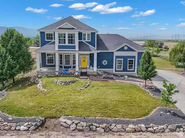 721 W Glovers Ln, Farmington, UT 84025 - view of front of property featuring a front lawn, covered porch, roof with shingles, and a mountain view