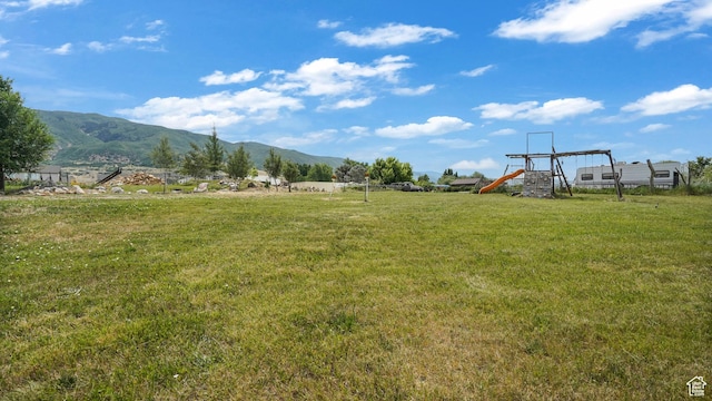 721 W Glovers Ln, Farmington, UT 84025 - view of green lawn featuring a mountain view and a playground