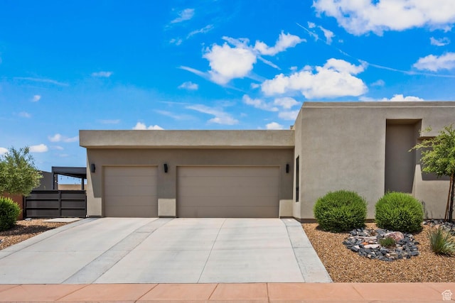 3214 S Red Sands Way, Hurricane, UT 84737 - southwest-style home featuring a garage, stucco siding, and driveway