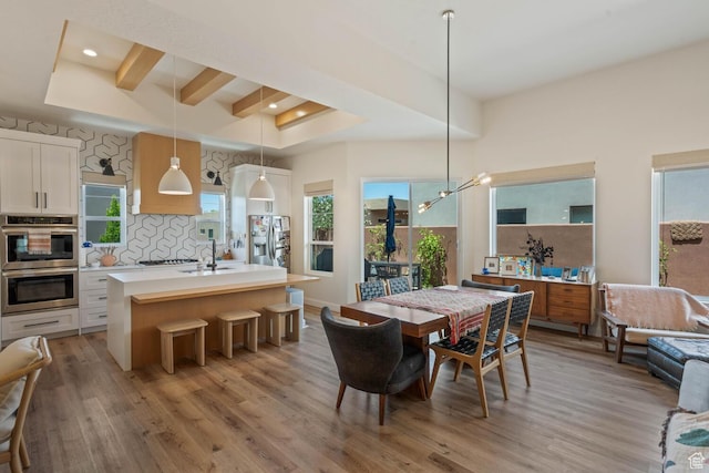 3214 S Red Sands Way, Hurricane, UT 84737 - dining room with light wood-style floors, recessed lighting, beamed ceiling, and a chandelier
