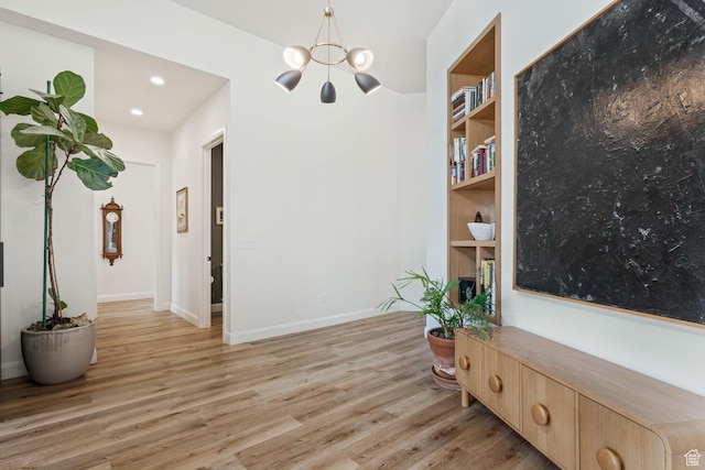 3214 S Red Sands Way, Hurricane, UT 84737 - sitting room with light wood-style flooring, a chandelier, recessed lighting, and built in features