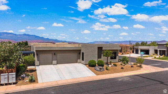 3214 S Red Sands Way, Hurricane, UT 84737 - adobe home featuring a mountain view, a garage, stucco siding, and concrete driveway
