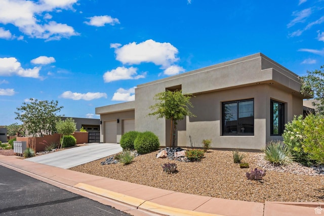 3214 S Red Sands Way, Hurricane, UT 84737 - view of front of property with an attached garage, stucco siding, and concrete driveway