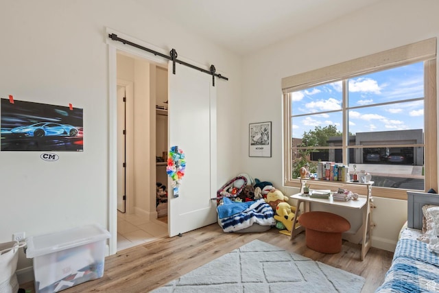 3214 S Red Sands Way, Hurricane, UT 84737 - sitting room featuring a barn door and wood finished floors
