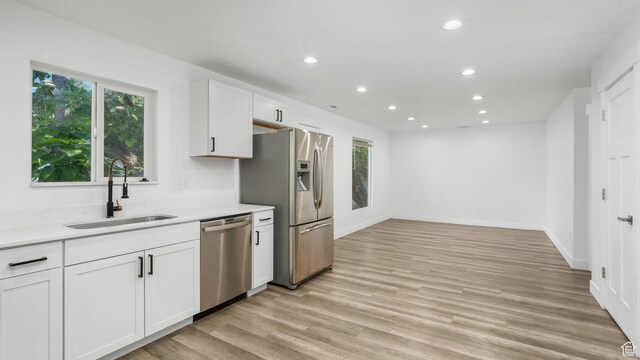 540 E 400 N, Spanish Fork, UT 84660 - kitchen with stainless steel appliances, recessed lighting, healthy amount of natural light, white cabinets, and light countertops