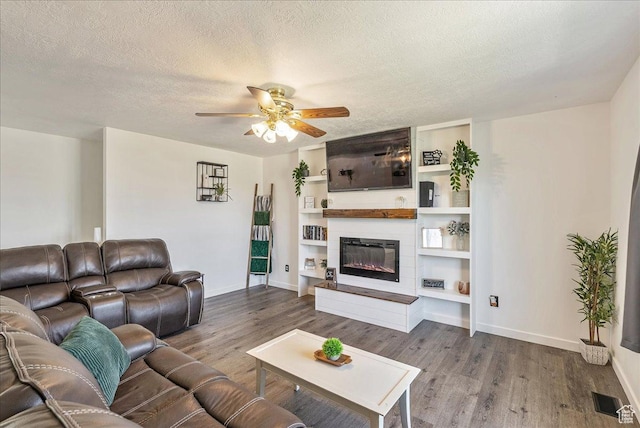 655 S 100 W, Santaquin, UT 84655 - living room with wood finished floors, ceiling fan, a textured ceiling, a fireplace, and built in features