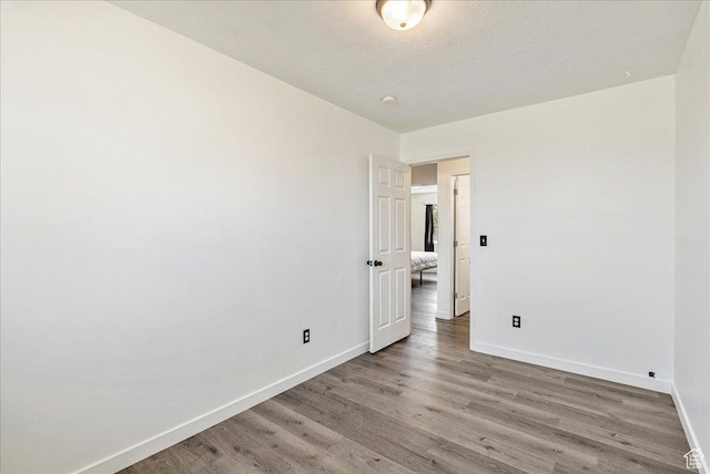 655 S 100 W, Santaquin, UT 84655 - spare room featuring baseboards and light wood-style floors