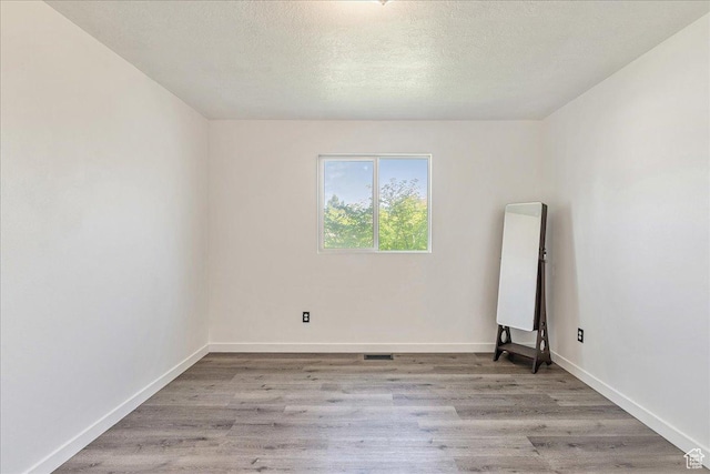 655 S 100 W, Santaquin, UT 84655 - empty room featuring wood finished floors and a textured ceiling