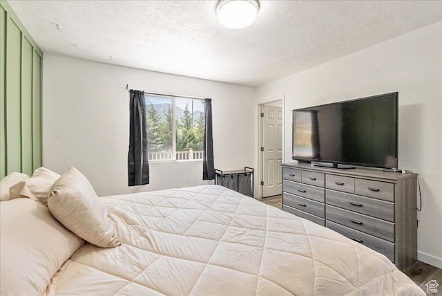 655 S 100 W, Santaquin, UT 84655 - bedroom featuring wood finished floors and a textured ceiling