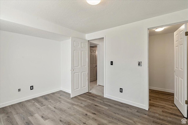 655 S 100 W, Santaquin, UT 84655 - unfurnished bedroom with wood finished floors and a textured ceiling