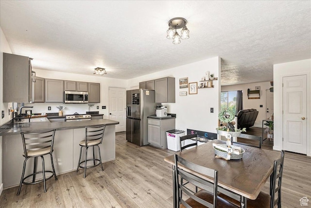 655 S 100 W, Santaquin, UT 84655 - dining area with light wood-type flooring and a textured ceiling