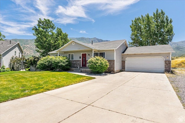 655 S 100 W, Santaquin, UT 84655 - single story home featuring a mountain view, brick siding, an attached garage, and a front yard