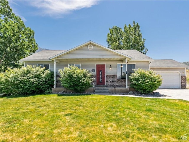 655 S 100 W, Santaquin, UT 84655 - view of front facade featuring a front lawn, driveway, a garage, and brick siding