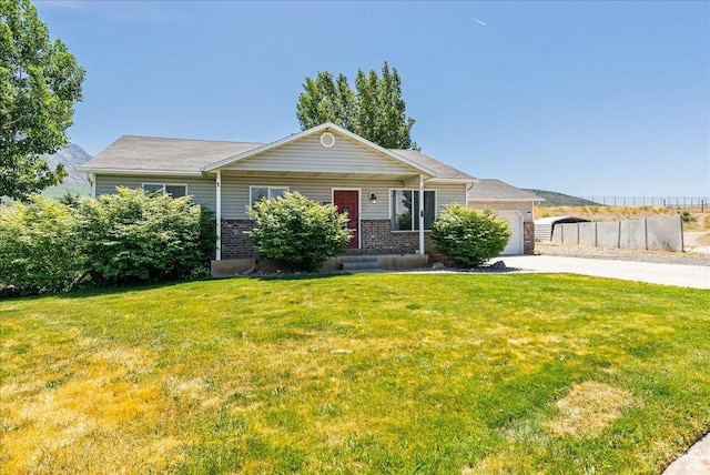 655 S 100 W, Santaquin, UT 84655 - ranch-style house featuring driveway, a front lawn, an attached garage, and brick siding