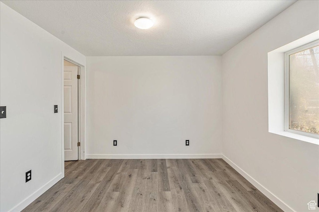 655 S 100 W, Santaquin, UT 84655 - spare room with wood finished floors and a textured ceiling