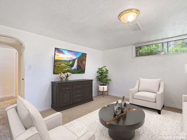 143 N 800 W, Provo, UT 84601 - living room with light carpet, arched walkways, and a textured ceiling