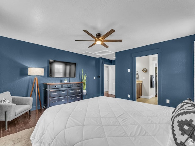 4966 W Willamette Way S, South Jordan, UT 84095 - bedroom with wood finished floors, ensuite bath, a ceiling fan, and a textured ceiling
