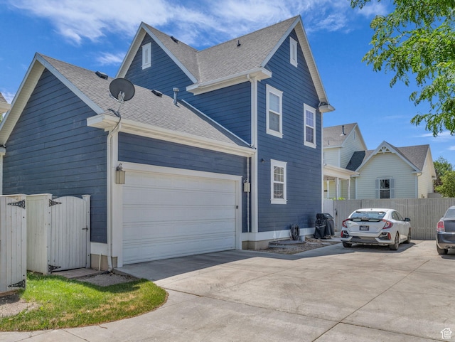 4966 W Willamette Way S, South Jordan, UT 84095 - view of side of property with concrete driveway, a shingled roof, and a gate
