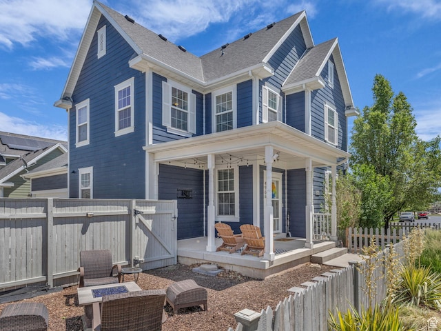 4966 W Willamette Way S, South Jordan, UT 84095 - view of front of property featuring a gate, covered porch, an outdoor fire pit, and roof with shingles