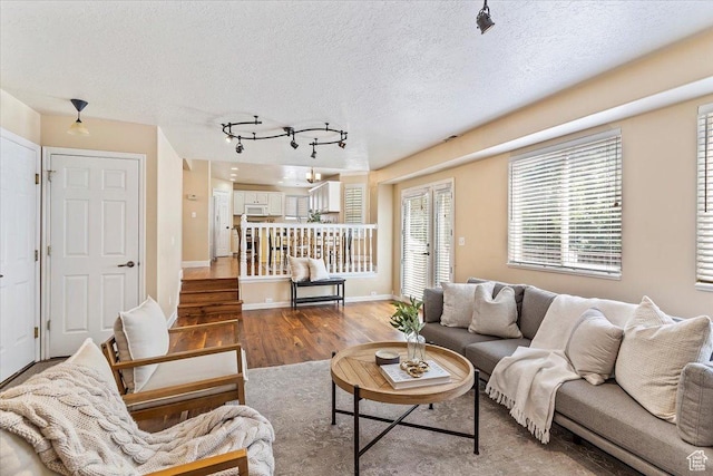 677 E 2900 N, North Ogden, UT 84414 - living room with wood finished floors, a textured ceiling, and track lighting